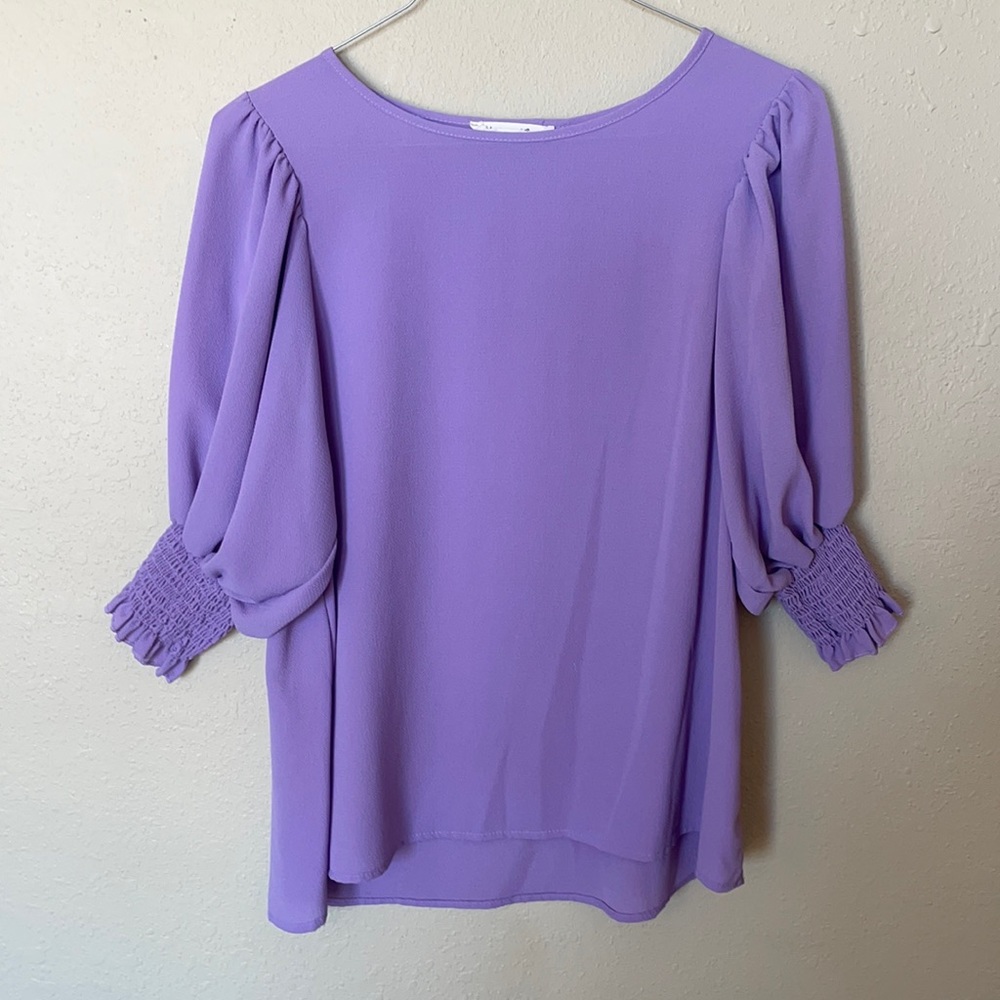 Lavender top, with gathered sleeves.